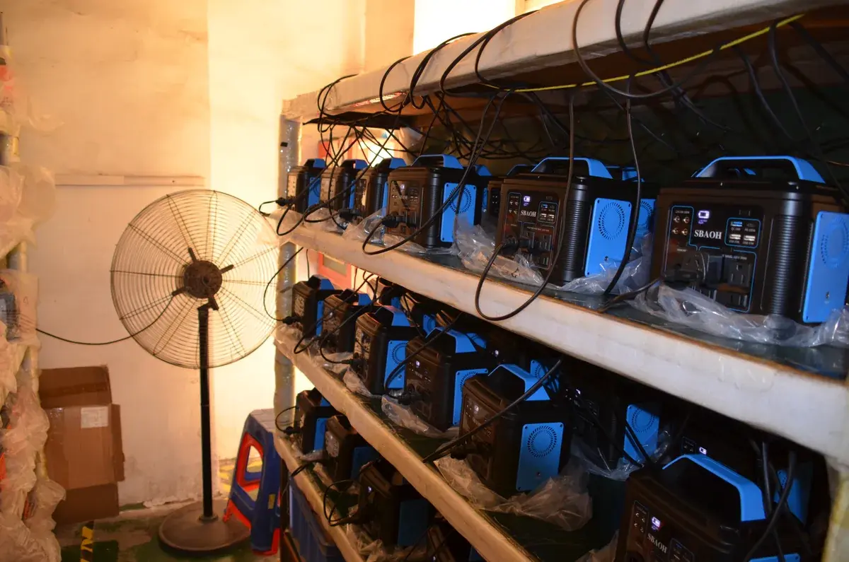 Portable power stations connected on racks for aging testing
